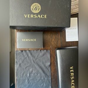 Versace black shades worn a couple times no scratches.